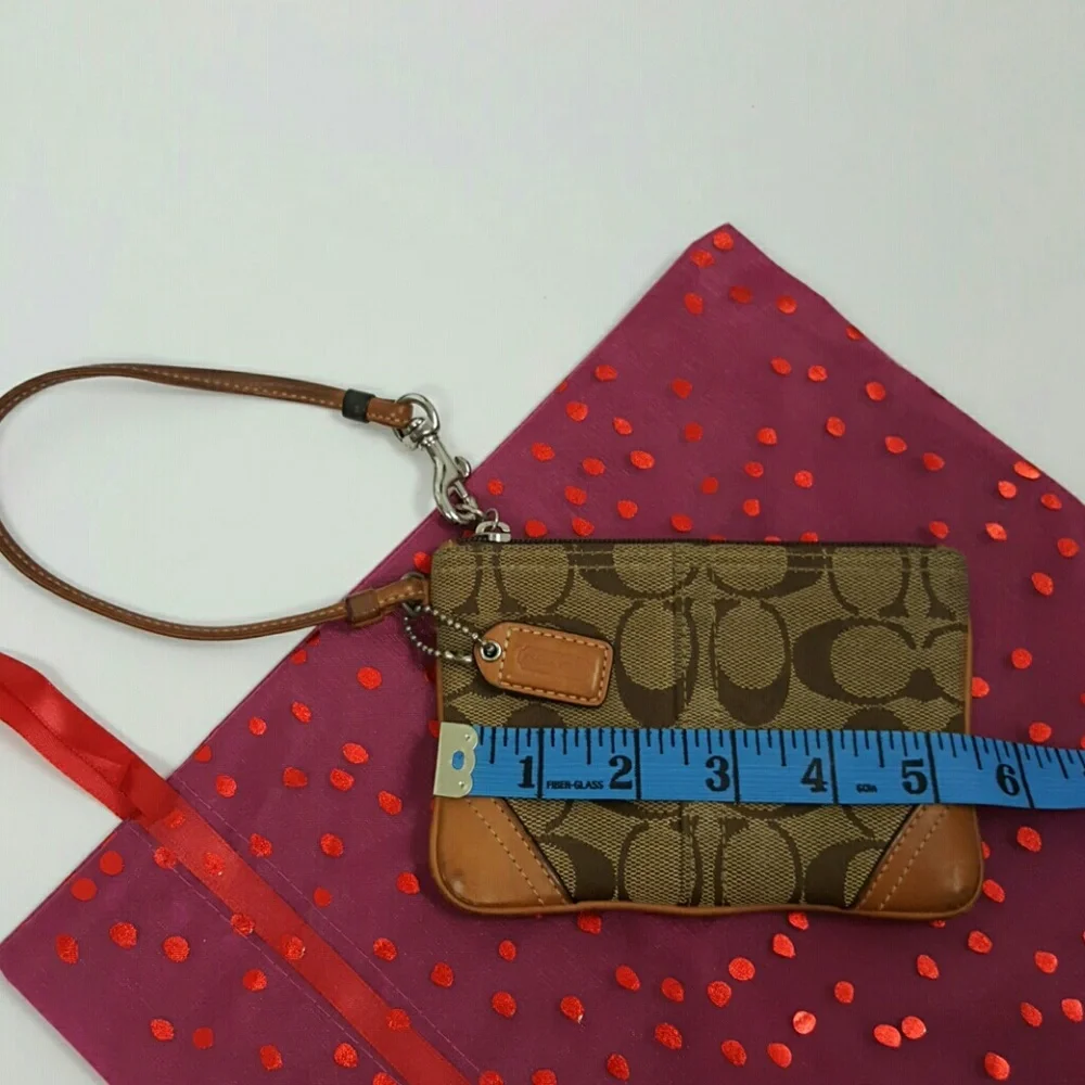 Coach brown canvas wristlet